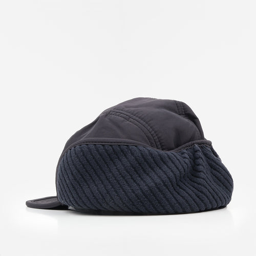 Corduroy earflap detail on the black winter cap