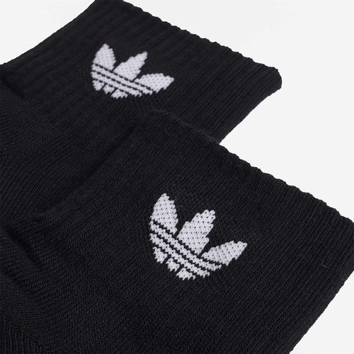White Adidas trefoil logo on black ribbed sock