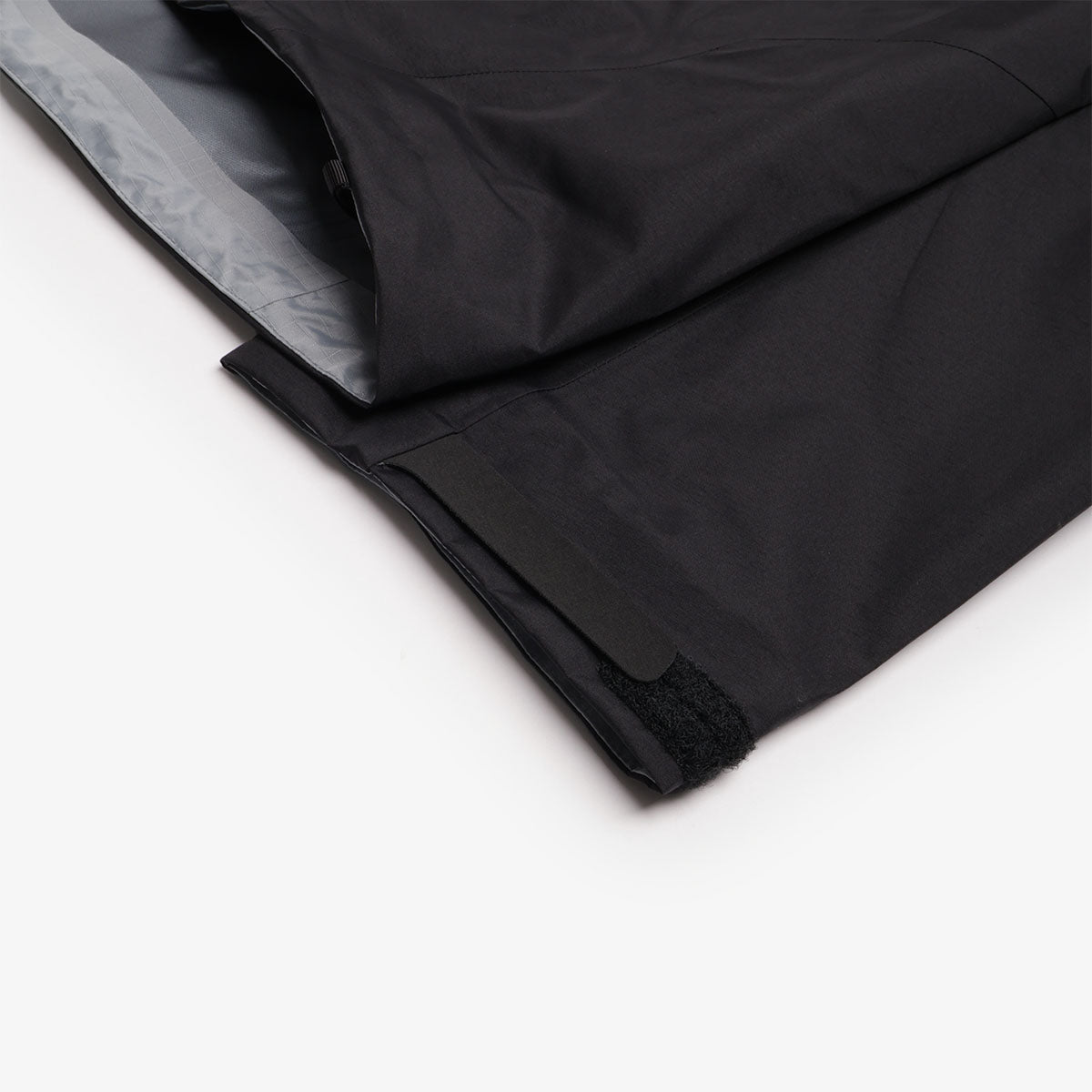 Adjustable hem detail, black Arc'teryx shell