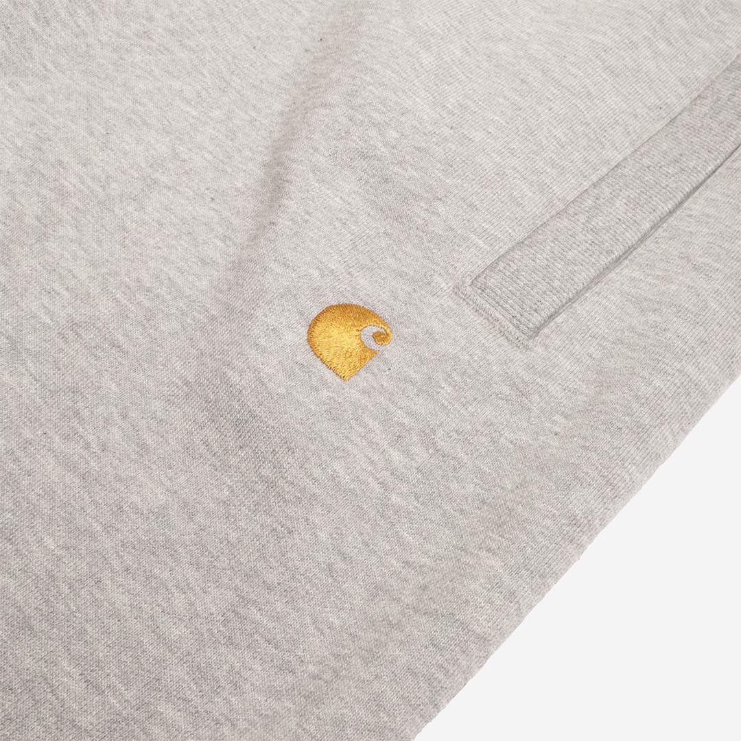 Embroidered gold Carhartt C logo on grey sweat pant