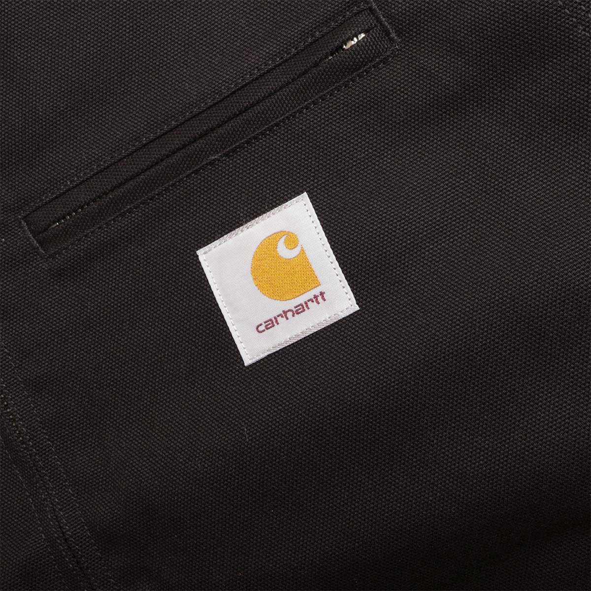 Carhartt WIP square label on the black canvas chest pocket