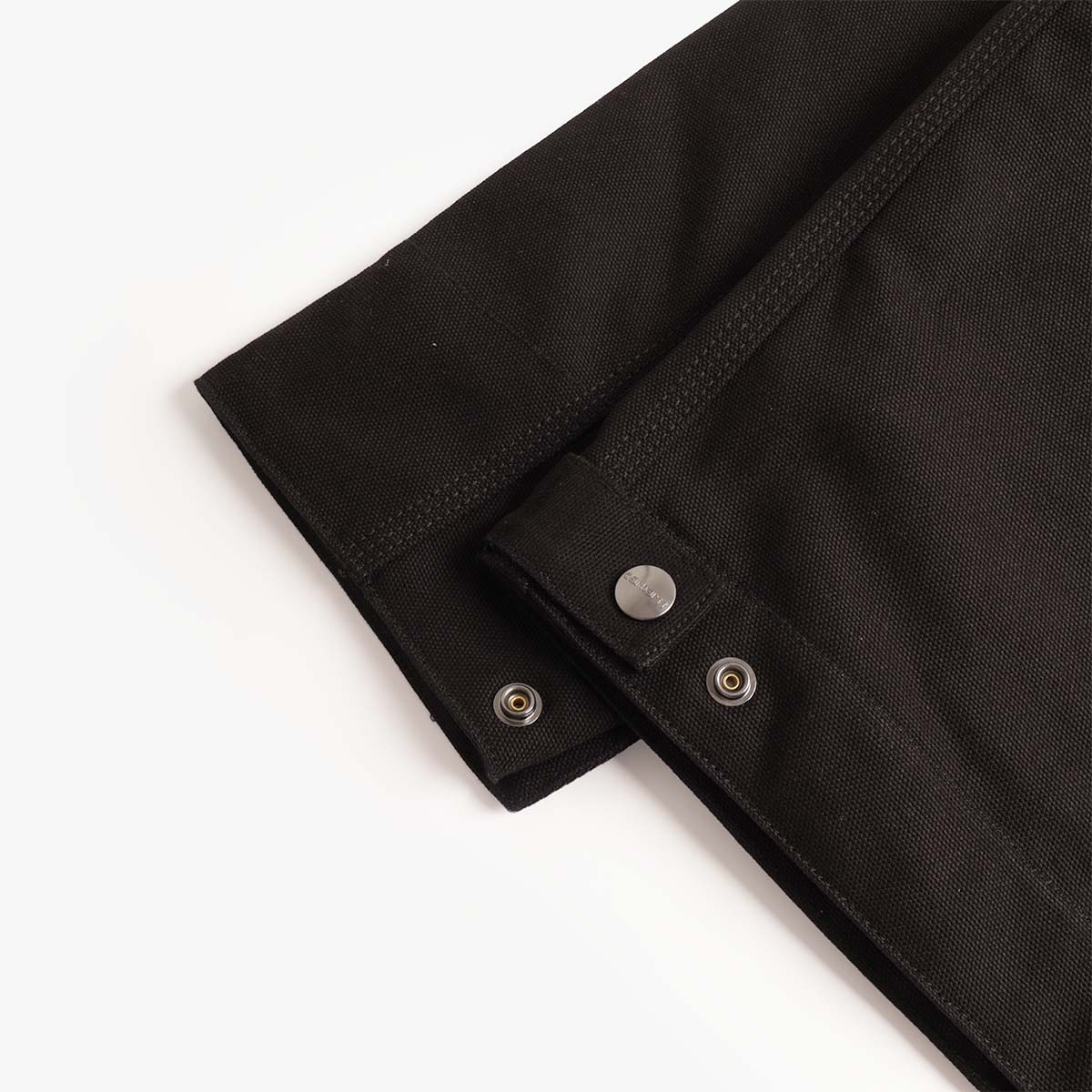 Snap cuff detail on the black Carhartt WIP Detroit jacket