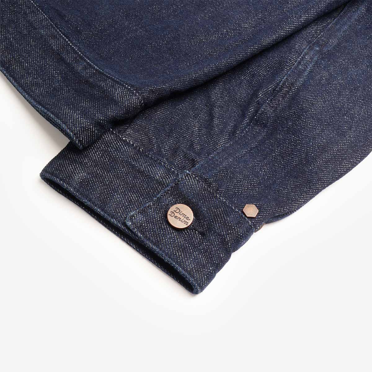 Buttoned cuff detail on indigo denim, Dime jacket