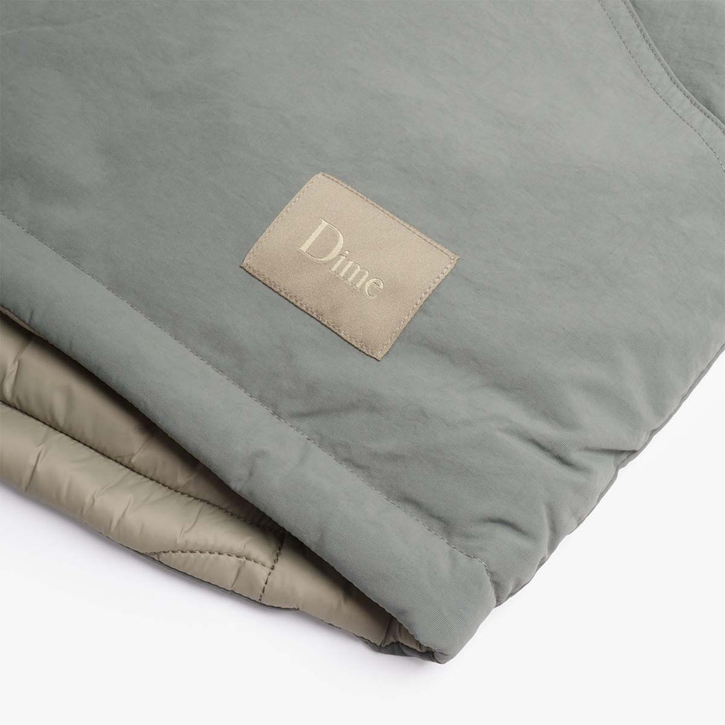 Dime woven label and quilted reverse side, Reversible vest