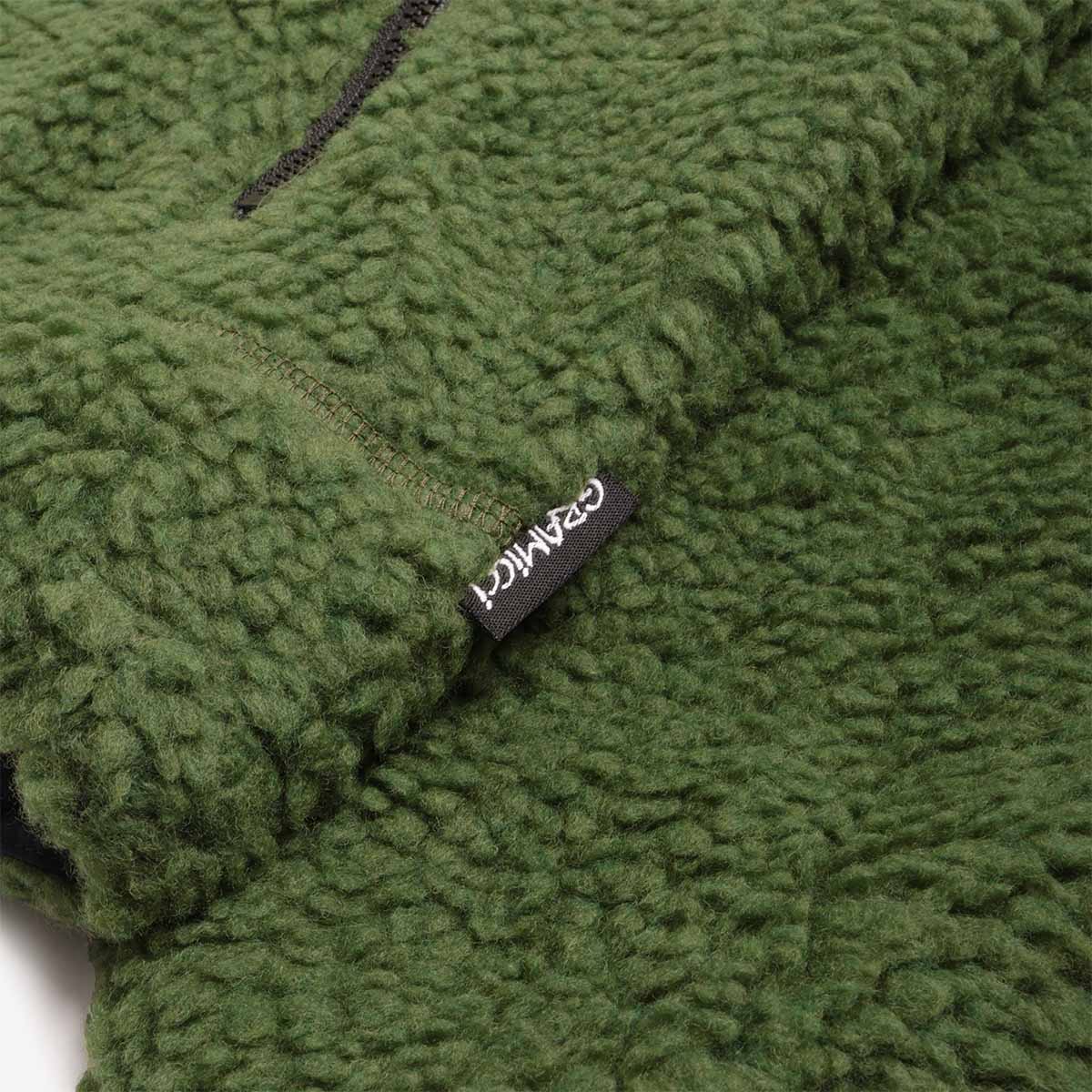 Gramicci woven label on olive sherpa fleece hem