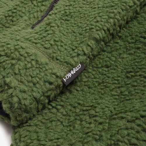 Gramicci woven label on olive sherpa fleece hem