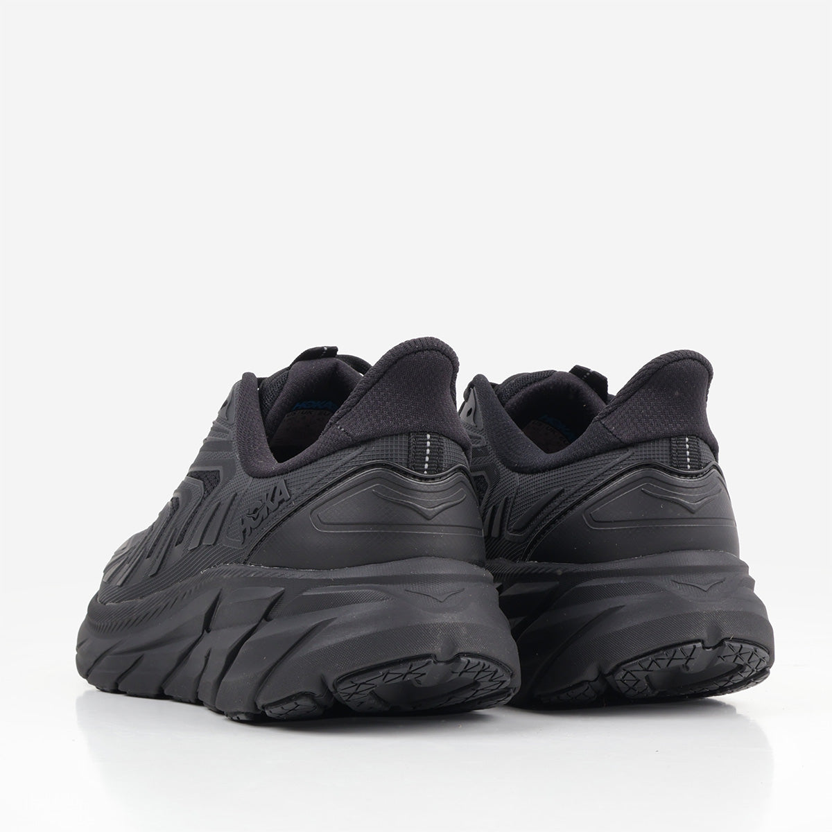 HOKA Clifton Utility Shoes in Black, back view