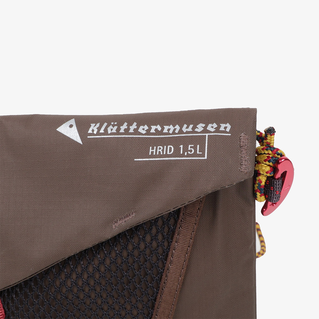 Klattermusen Hrid logo on brown crossbody bag