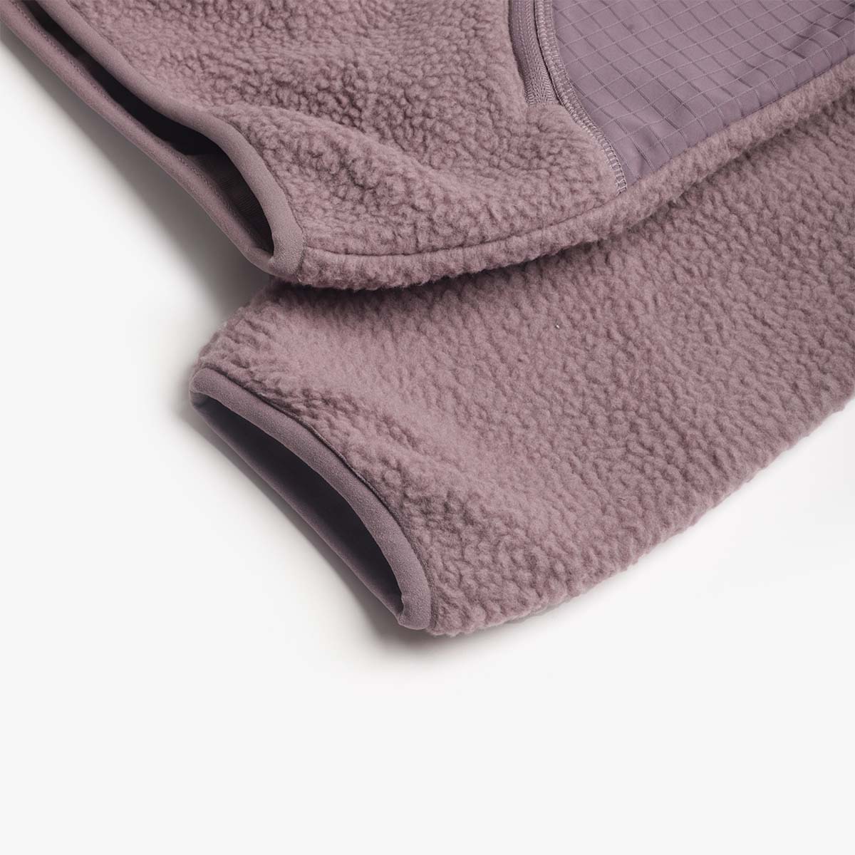 Hem and cuff detail on the plum sherpa fleece