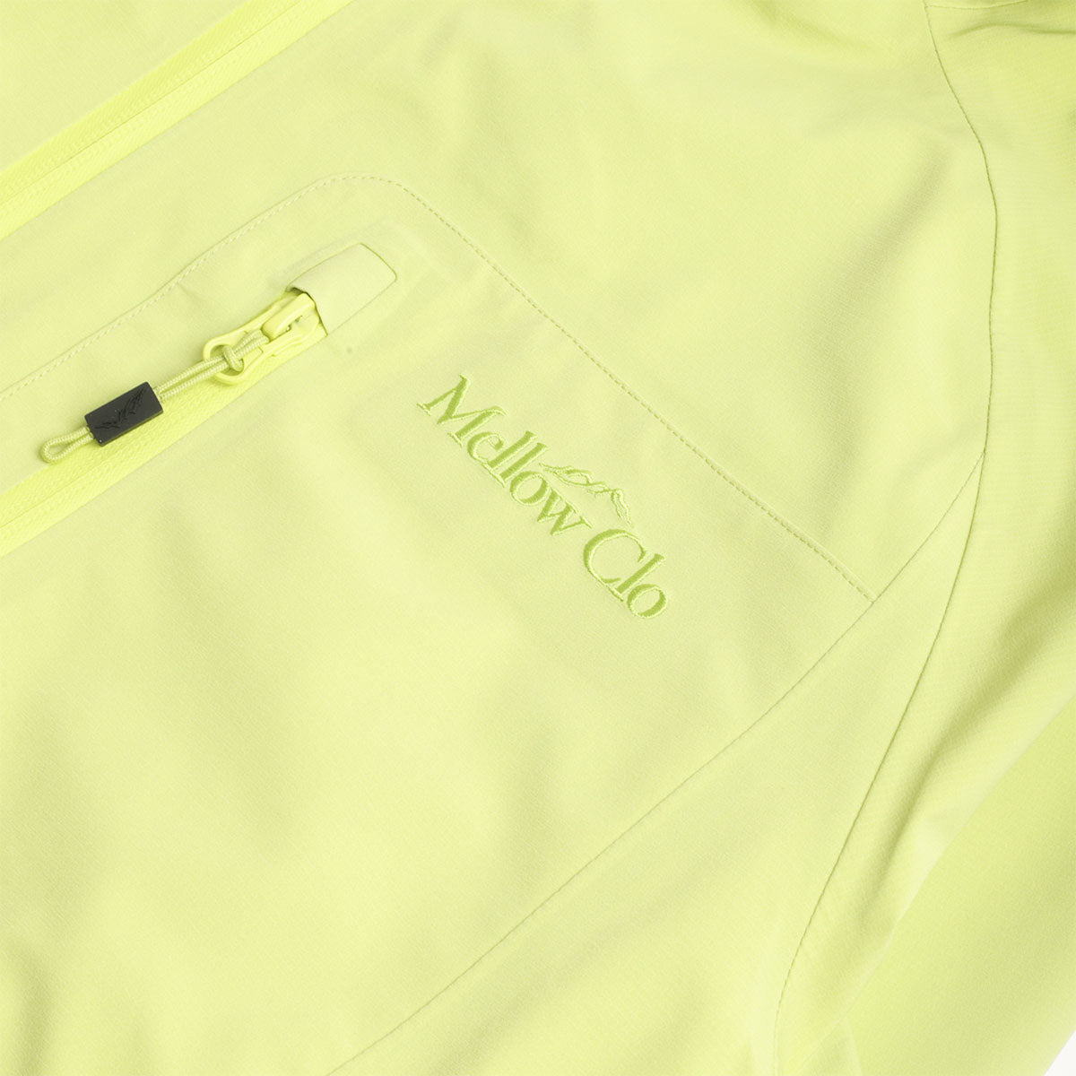 Chest pocket and Mellow Clo logo, lime Trek jacket