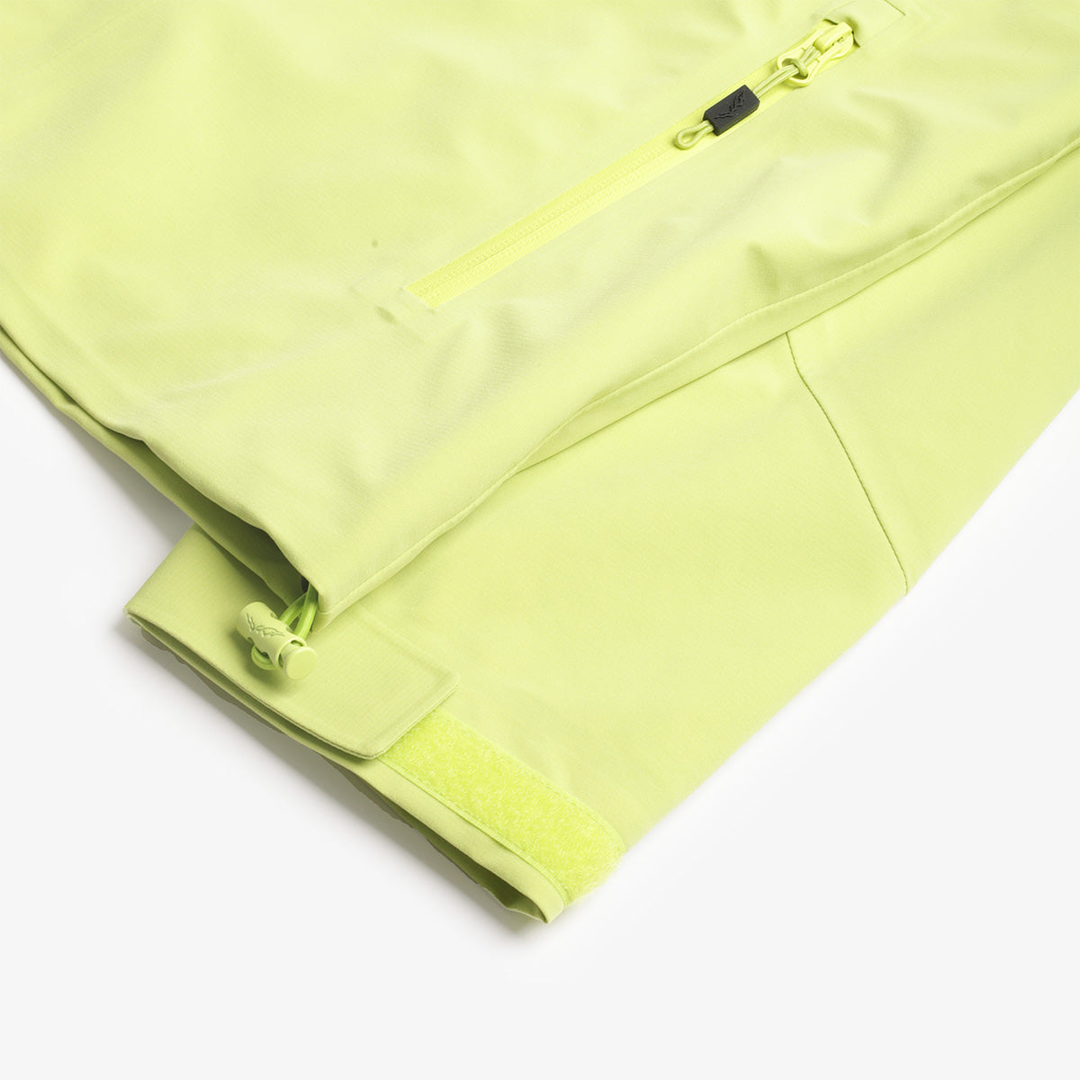 Hem and drawcord detail on the lime 3L shell jacket