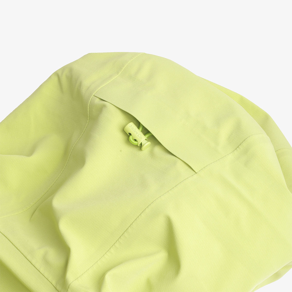 Sleeve pocket zip detail on the lime Trek jacket