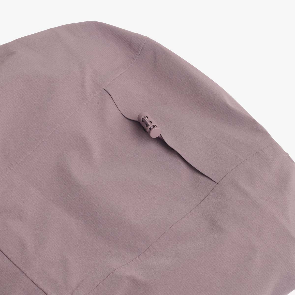 Sleeve pocket zip detail on the plum Trek jacket