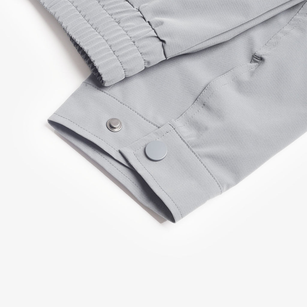 Snap button cuff detail on the grey Amble jacket