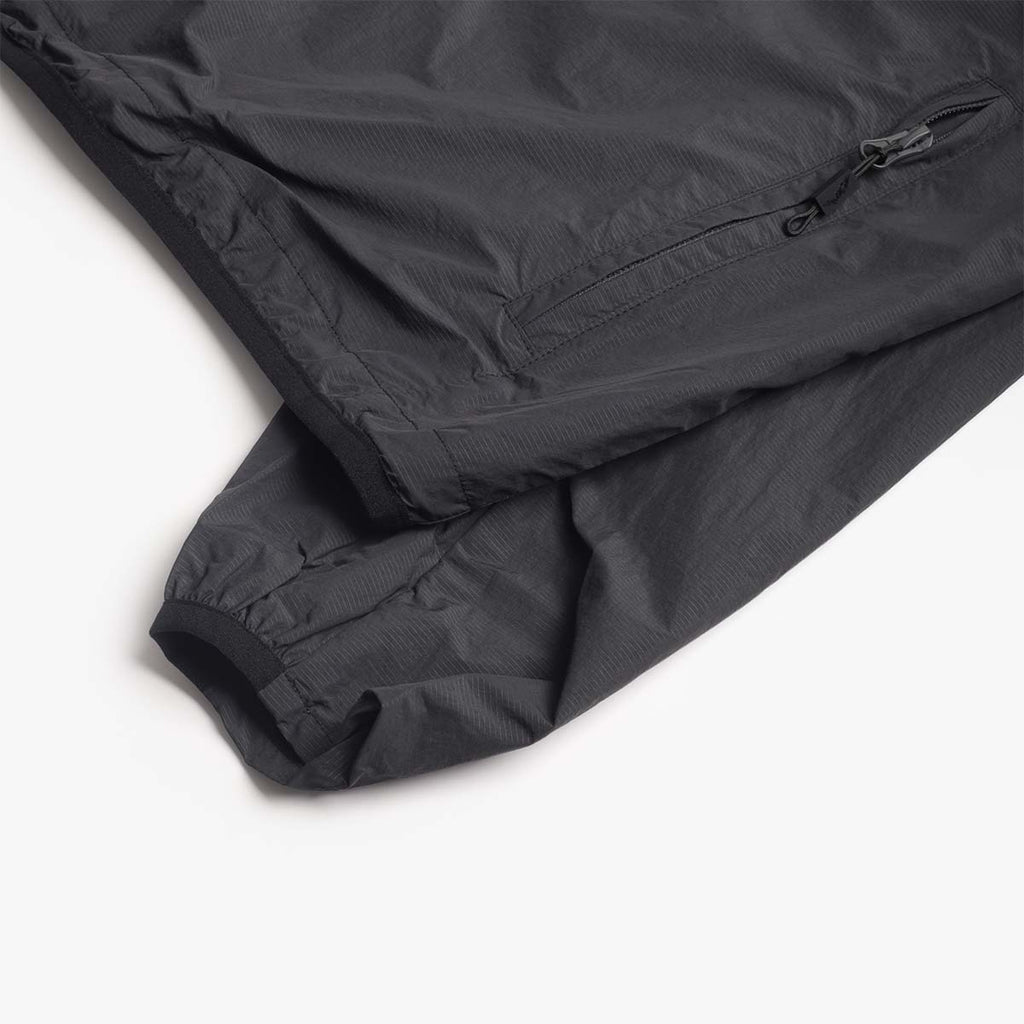 Zipped sleeve pocket detail on the black Boulder jacket