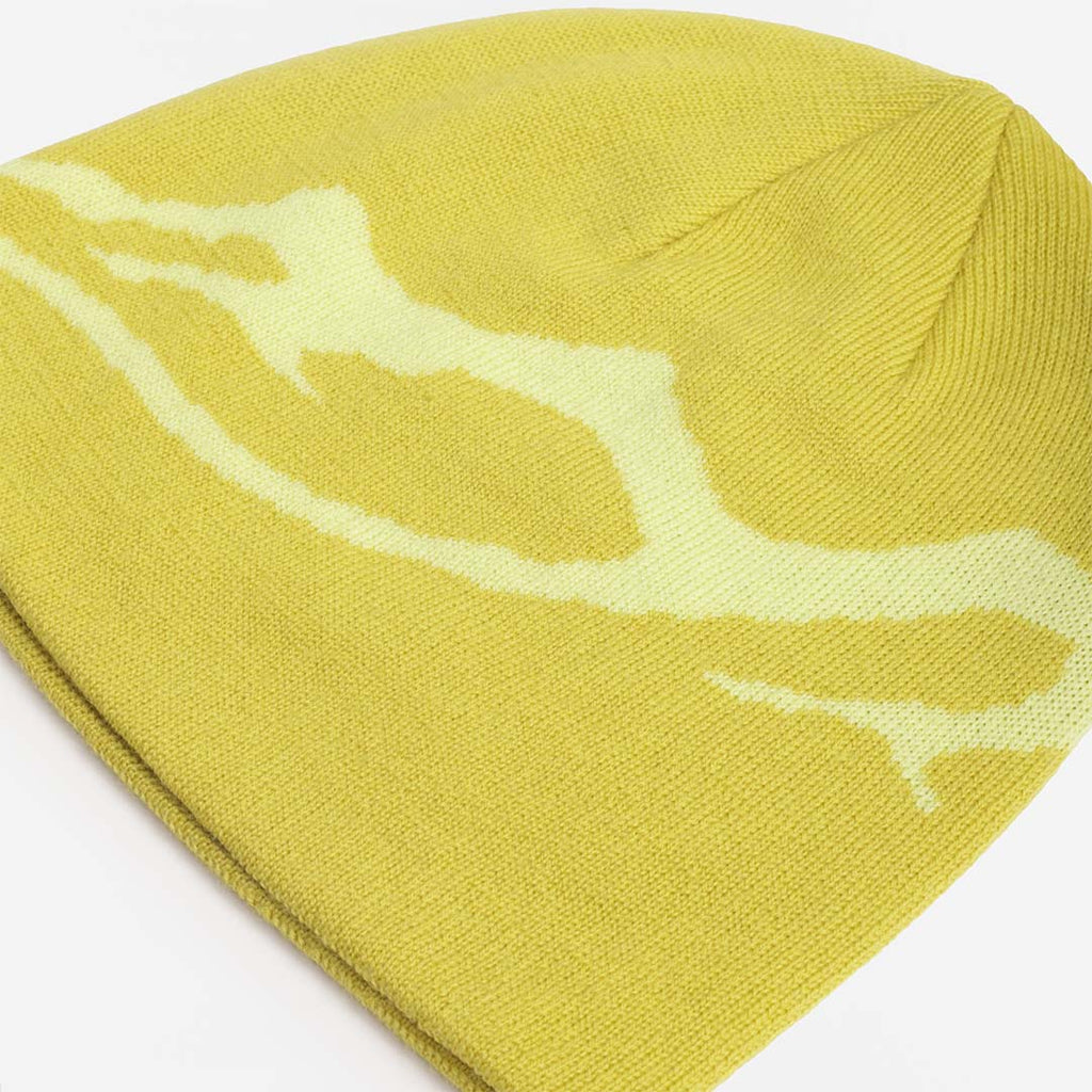 Knitted mountain motif across the lime merino beanie, top view