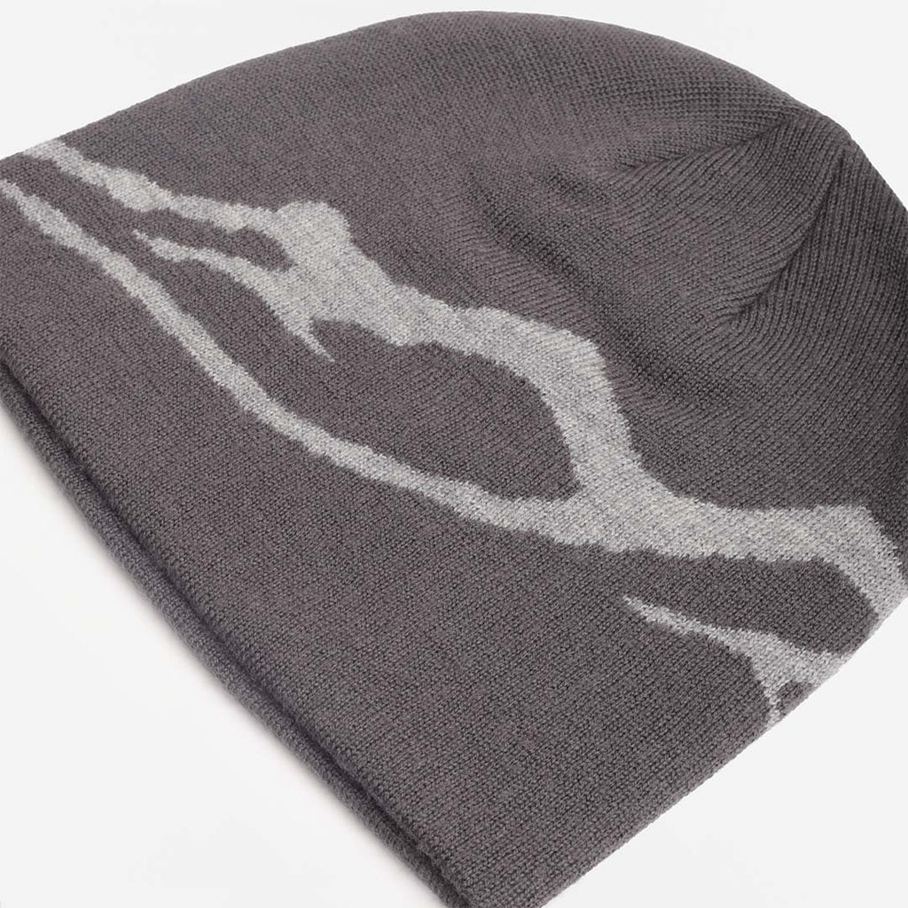 Knitted mountain motif across the grey merino beanie, top view