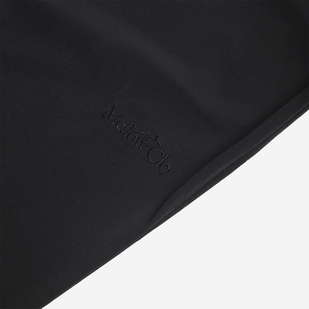 Tonal Mellow Clo logo on the black trouser leg