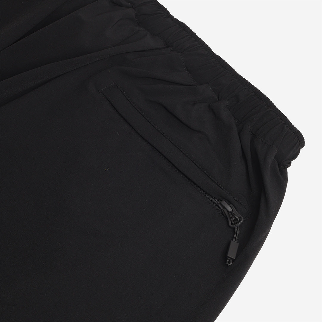 Zipped back pocket detail, black trousers