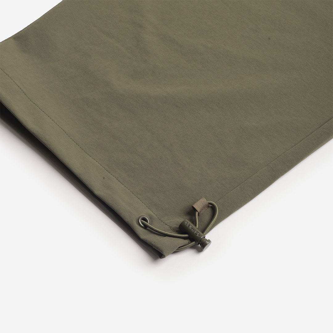 Adjustable drawcord hem on the olive trousers