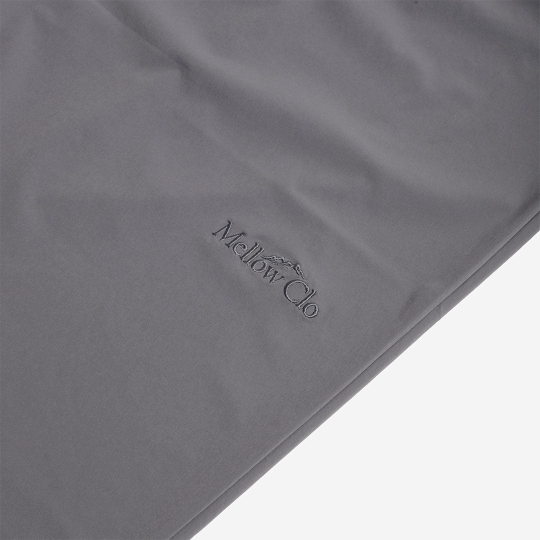 Tonal Mellow Clo logo on the grey trousers