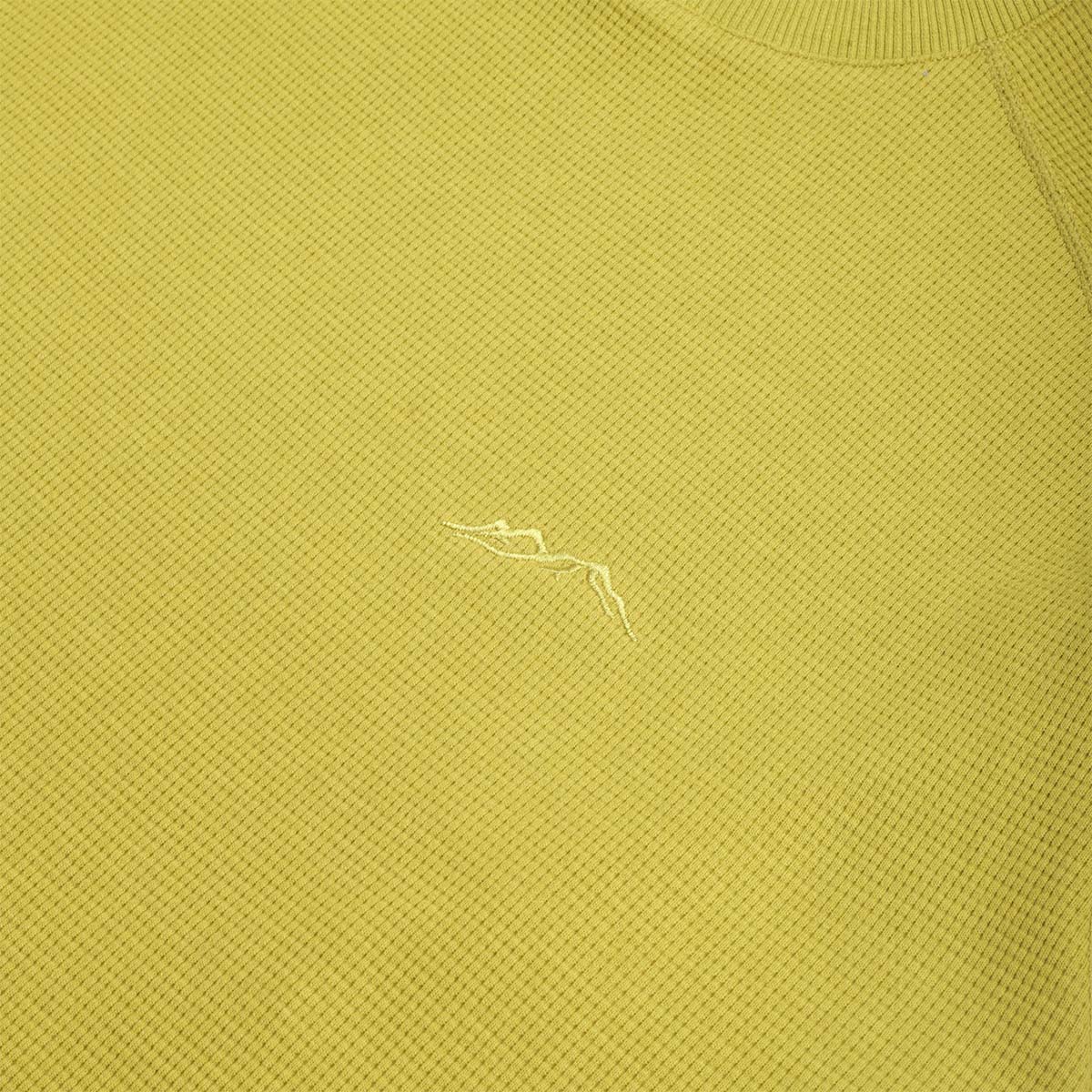 Tonal mountain logo on the lime waffle tee chest