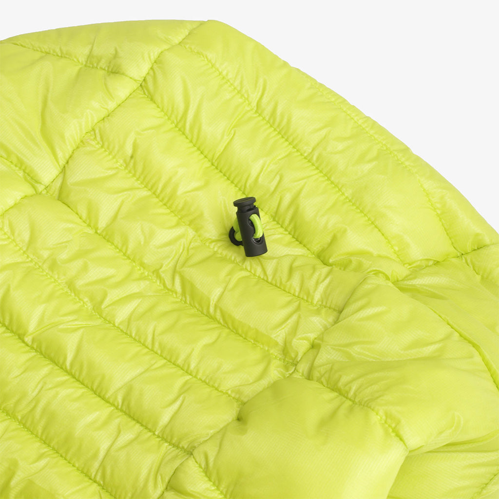 Hem drawcord toggle on the lime Alpine LT puffer