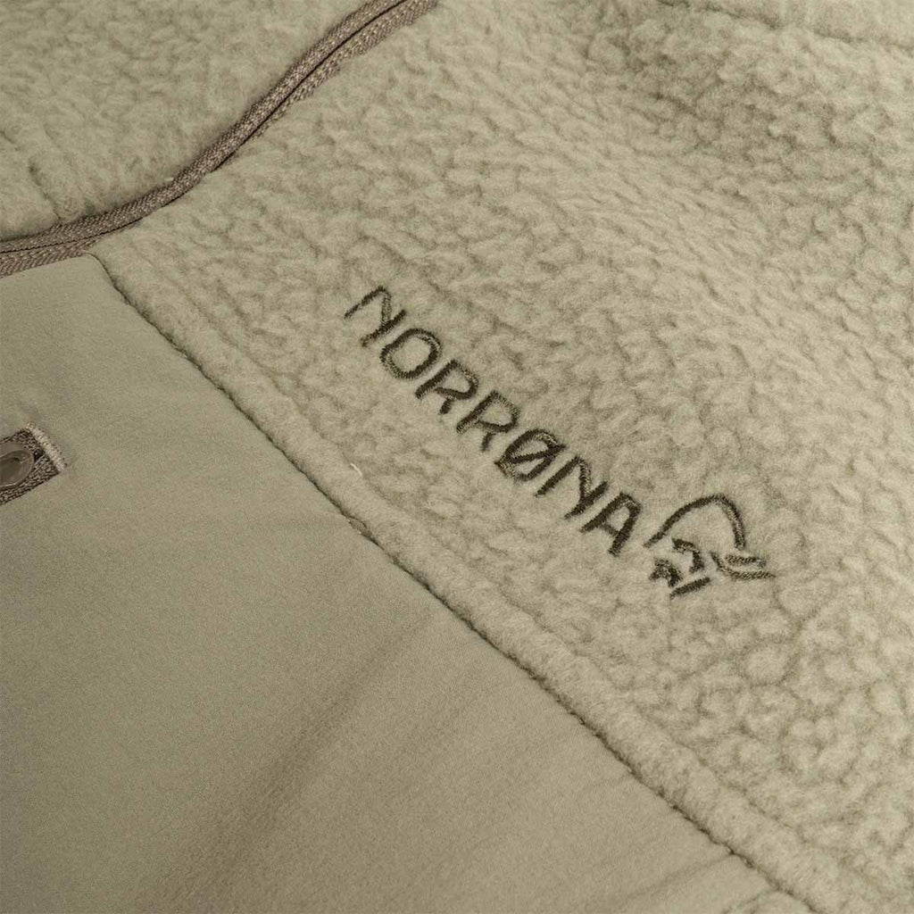 Norrona text logo on deep lichen green fleece jacket