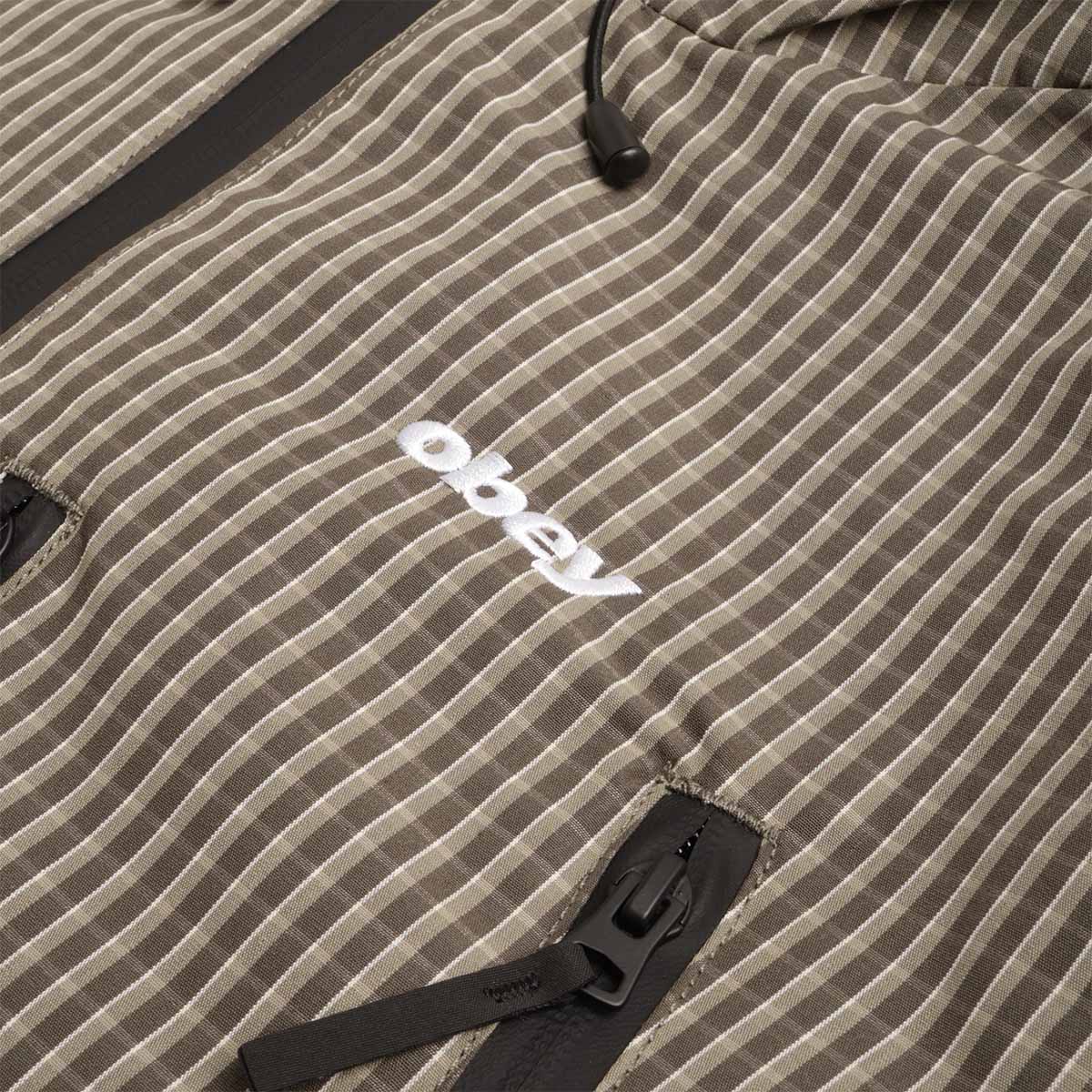 OBEY logo patch on green check fabric