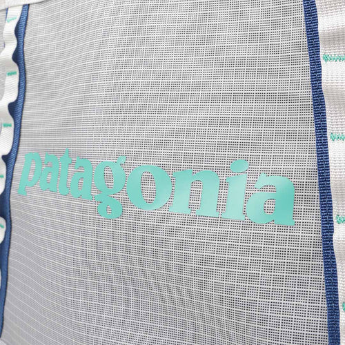 Patagonia logo detail on the Birch White Black Hole Tote