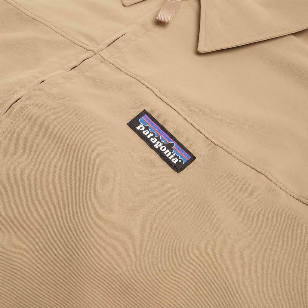 Patagonia label on khaki Isthmus jacket chest