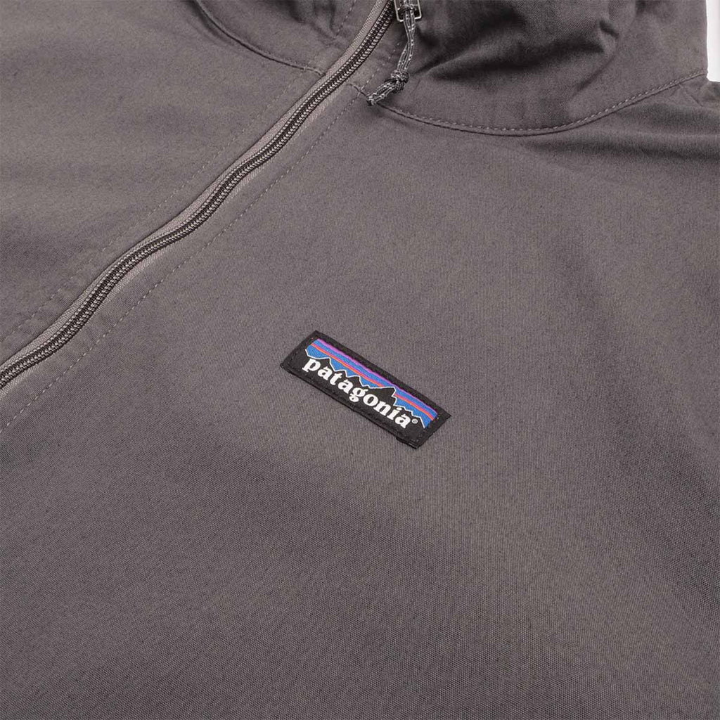 Patagonia label on forge grey Nomader jacket chest
