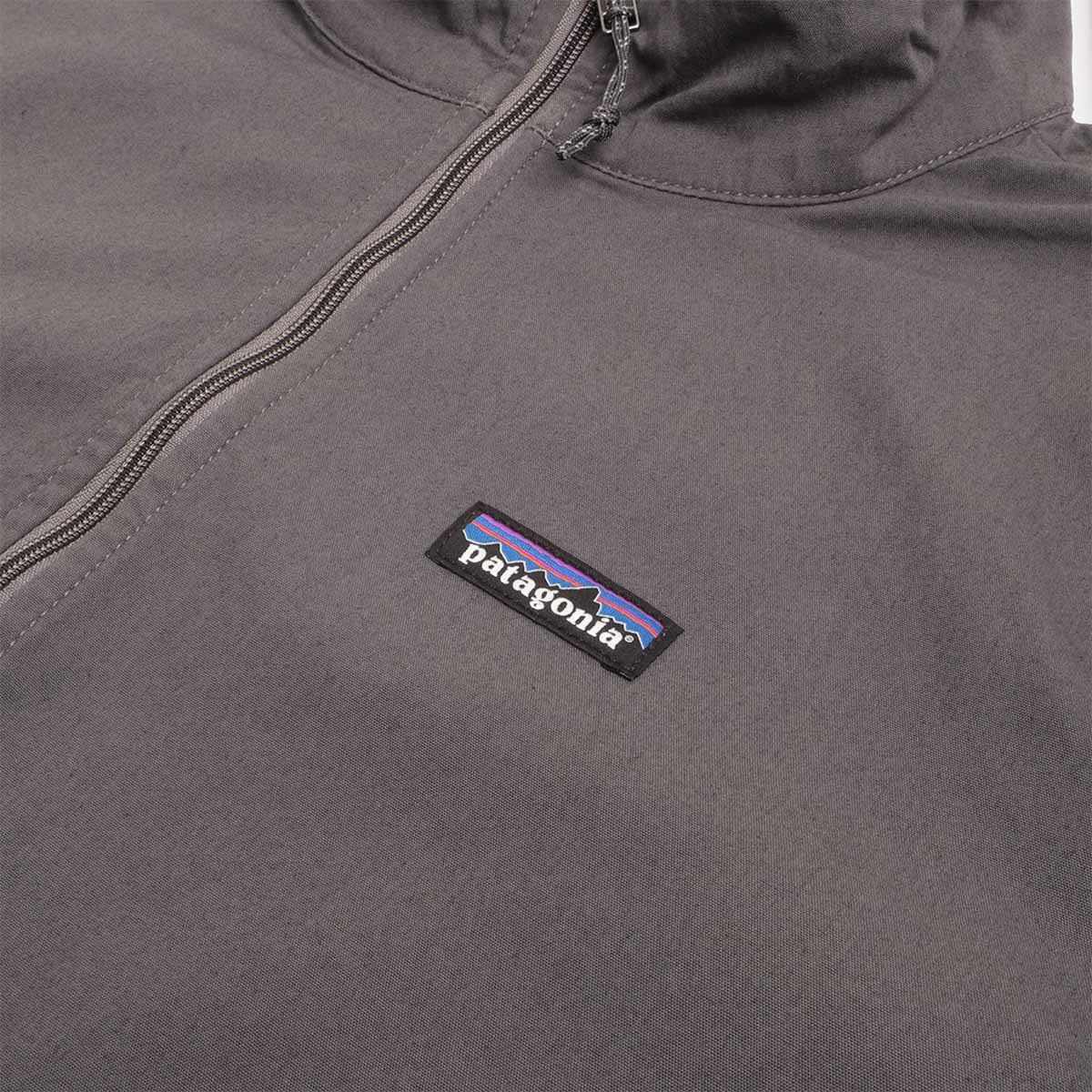 Patagonia label on forge grey Nomader jacket chest
