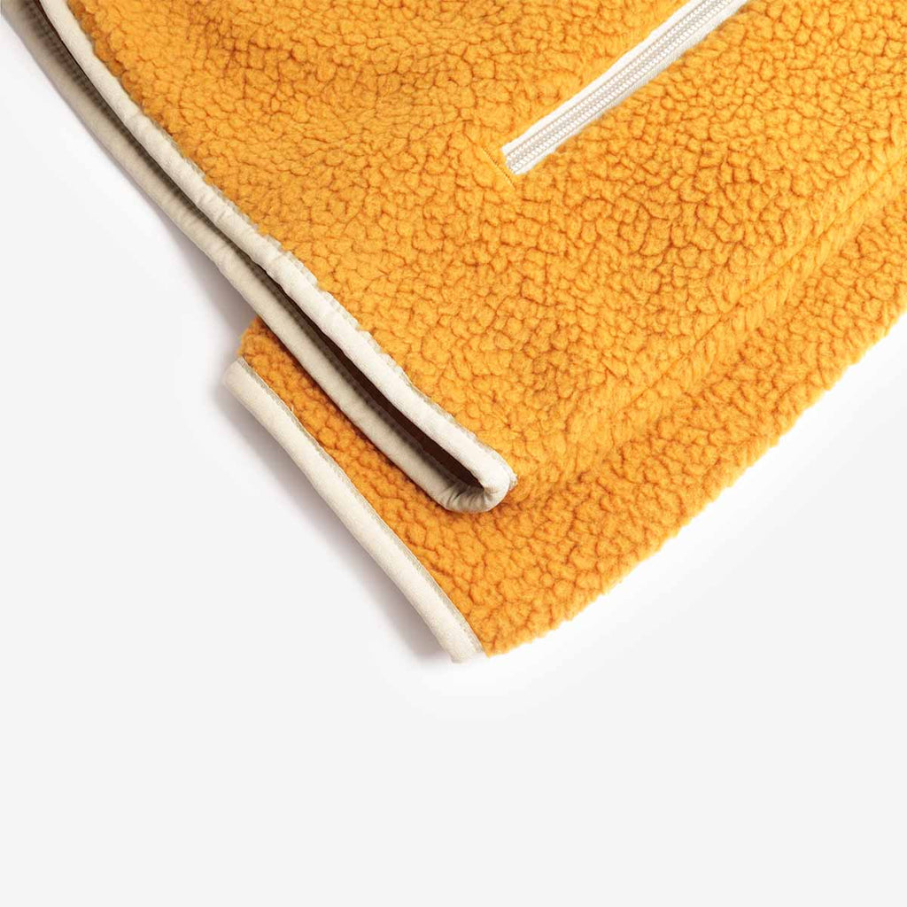 Cream-bound hem on gold high-pile fleece, Patagonia