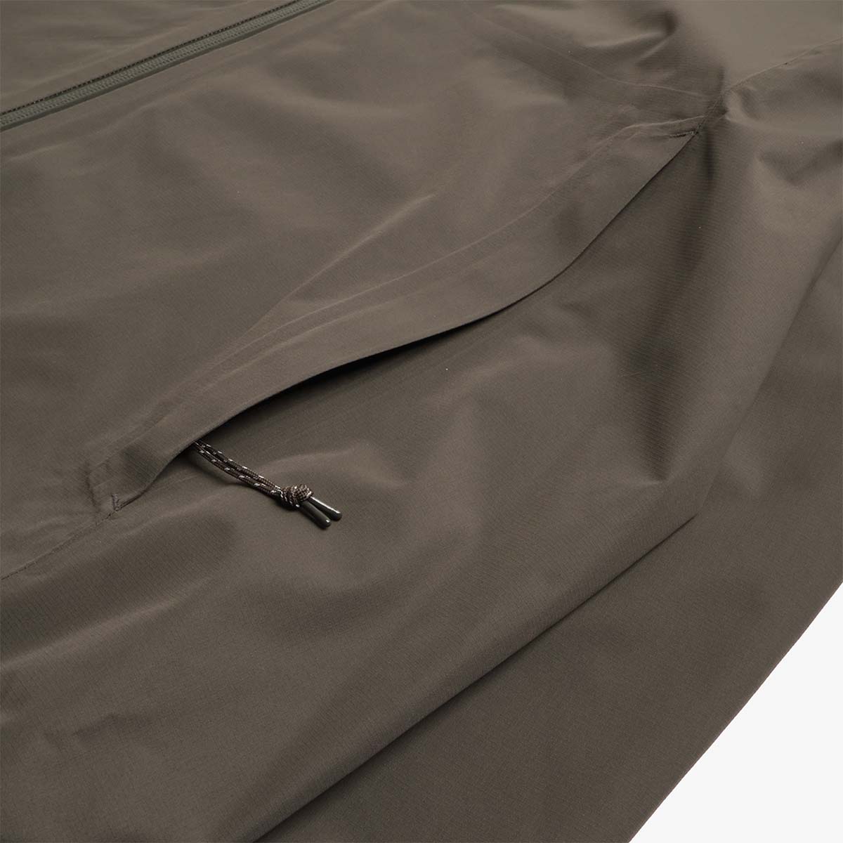 Zip pocket and drawcord pull detail, Treeline Shell Jacket