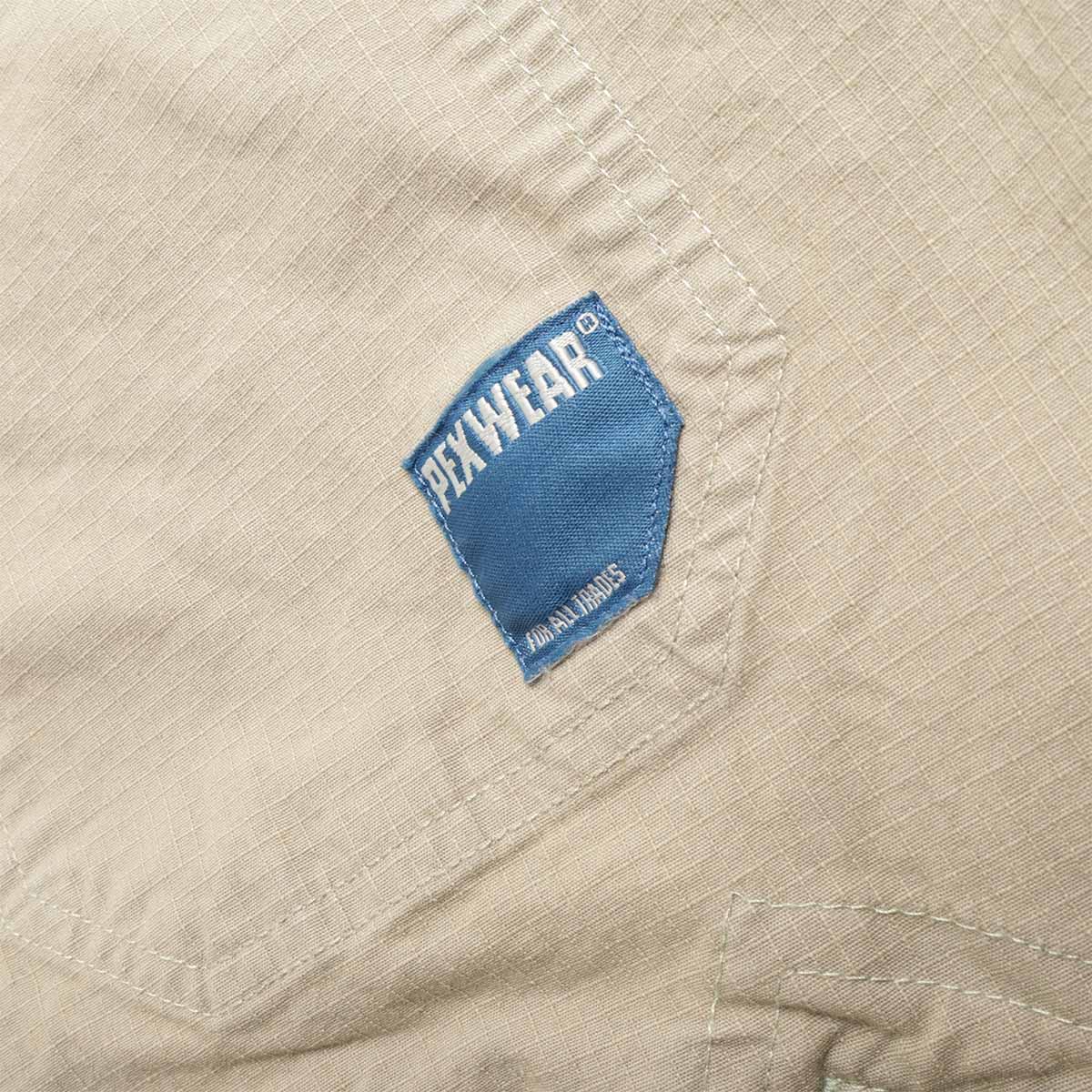Pexwear Mechanics Jacket in Faun Green Ripstop — front pocket and metal hardware close-up
