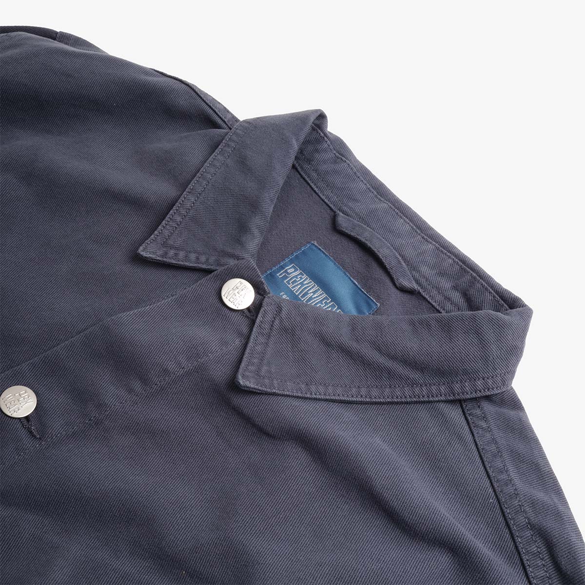 Pexwear Tradesman Jacket in Blue Twill — close-up of the heavyweight cotton twill fabric weave and stitching