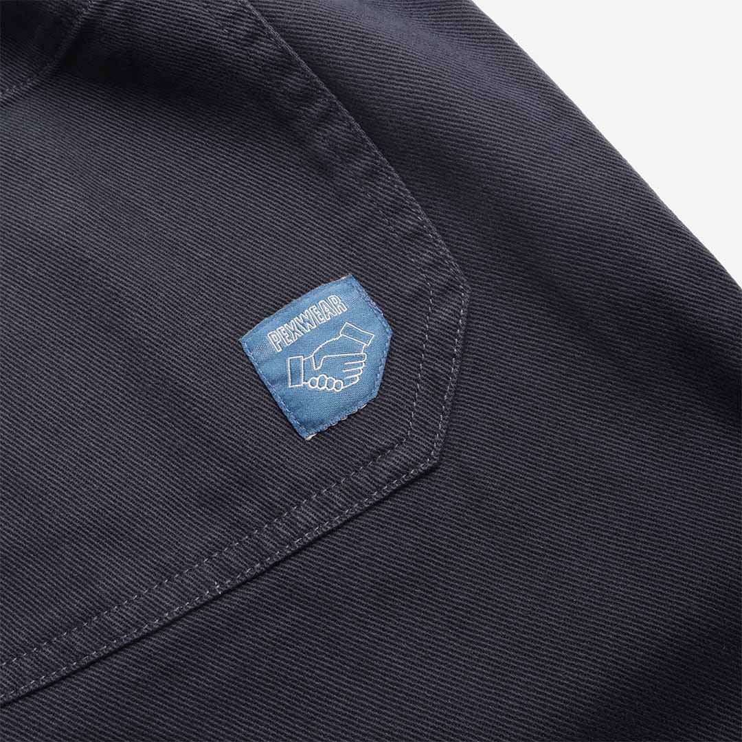 Pexwear Chefs Trousers in Deep Navy Twill — styled on model in a workwear setting, Urban Industry