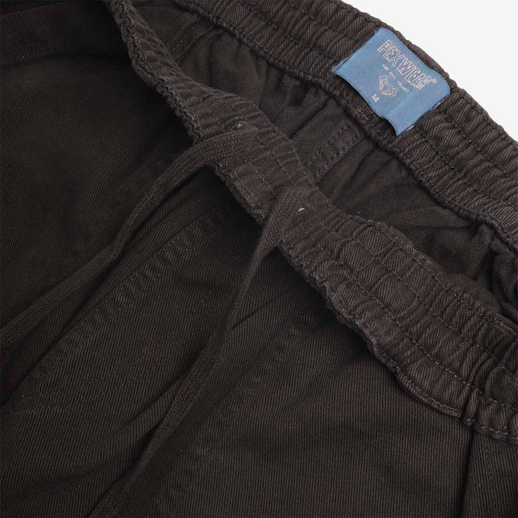 Pexwear Chefs Trousers in Black Twill — close-up of the heavyweight cotton twill fabric weave and stitching