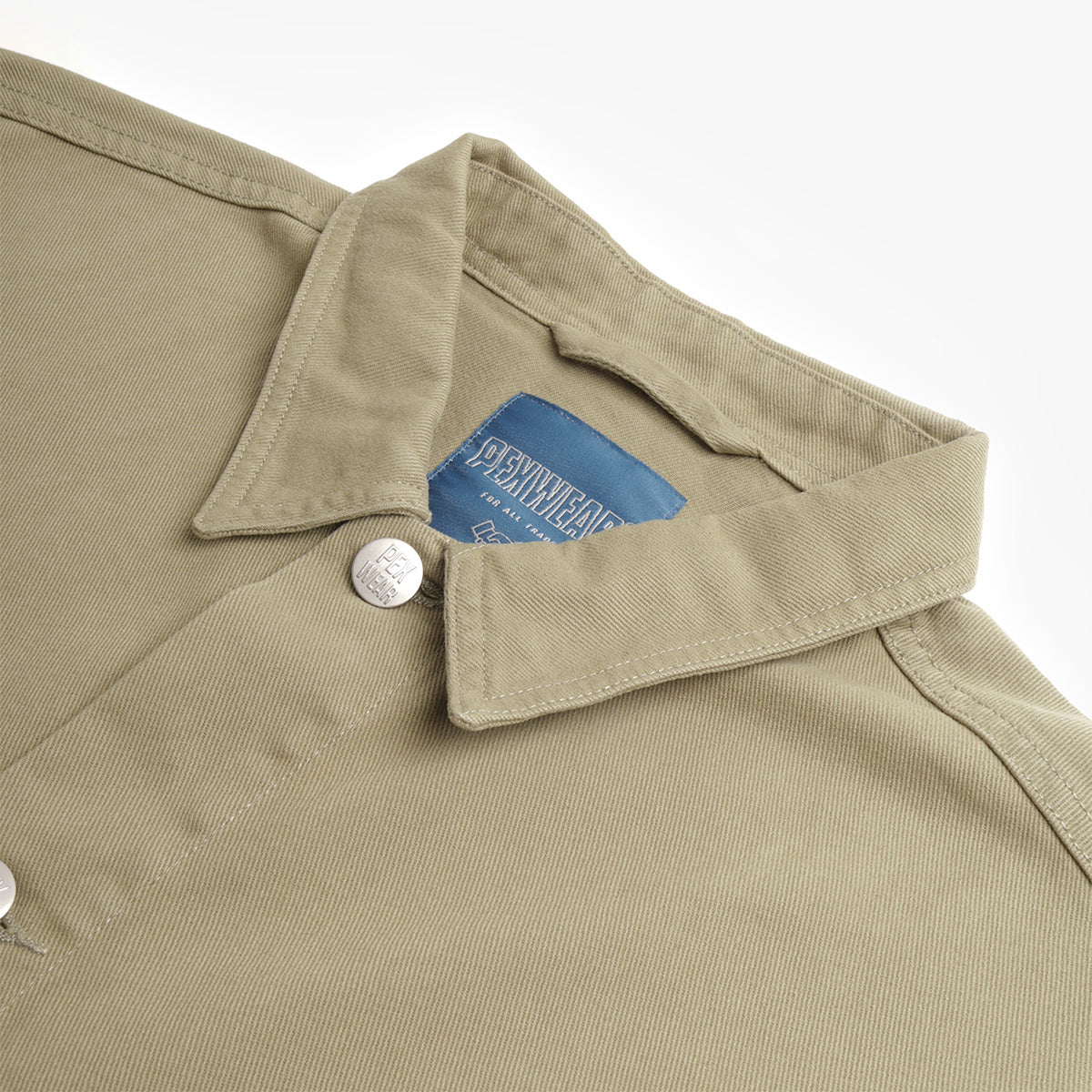 Pexwear Tradesman Jacket in Khaki Twill — close-up of the heavyweight cotton twill fabric weave and stitching