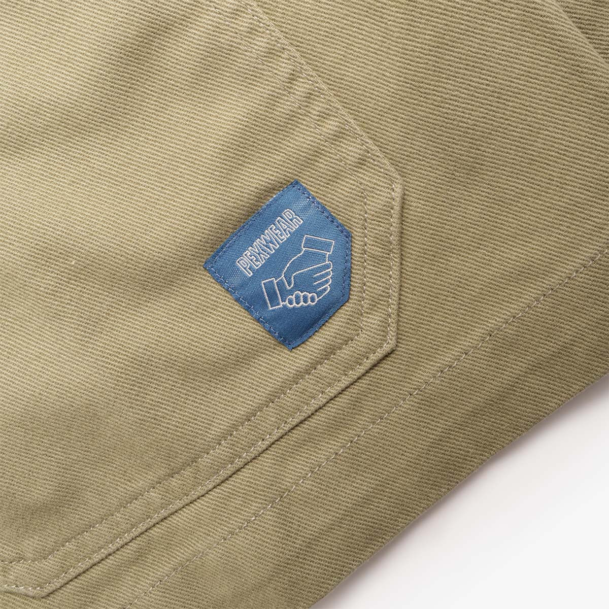 Pexwear Tradesman Jacket in Khaki Twill — styled on model in a workwear setting, Urban Industry