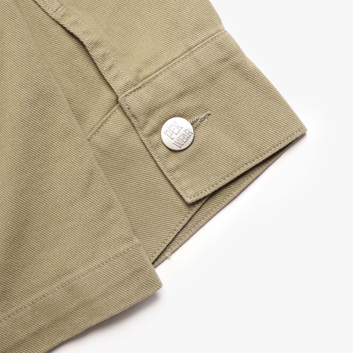 Pexwear Tradesman Jacket in Khaki Twill — front pocket and metal hardware close-up