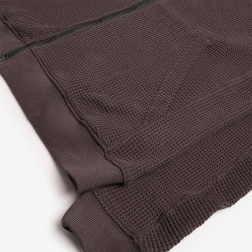 Hem, pocket and waffle knit texture, charcoal zip parka