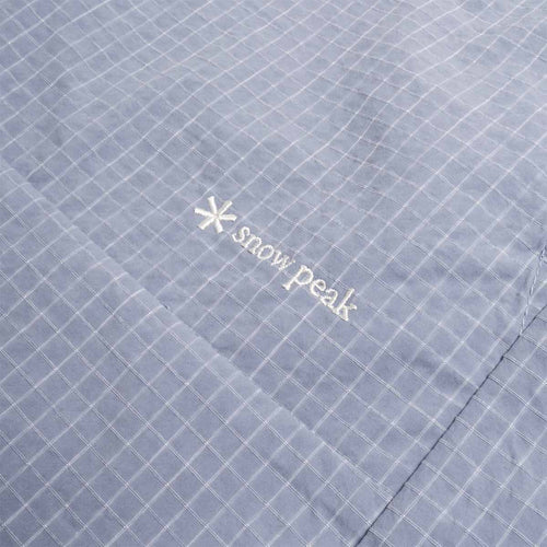 Embroidered Snow Peak logo on light blue kasuri fabric