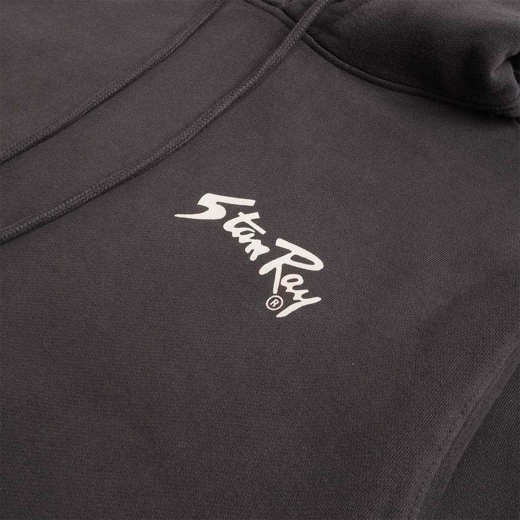 White Stan Ray script logo on washed black hoodie chest