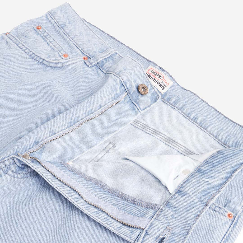 Button fly and slant pocket detail on Stan Ray mid wash jeans