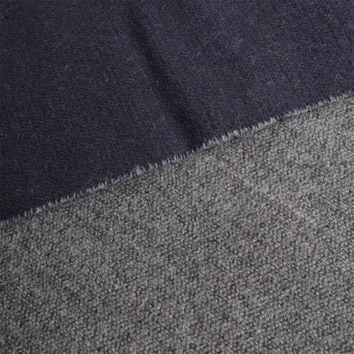 Wool fabric texture on navy and grey reversible scarf