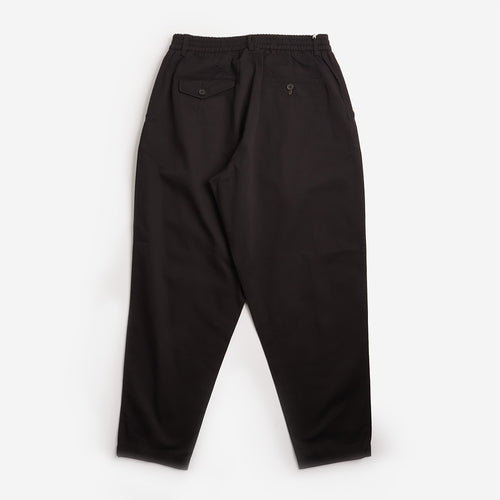 Universal Works Pleated Track Pant in Black, back view